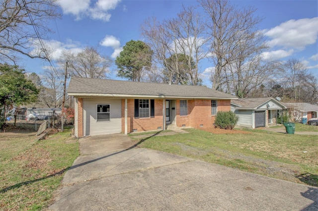 ranch-style home featuring a garage and a front lawn