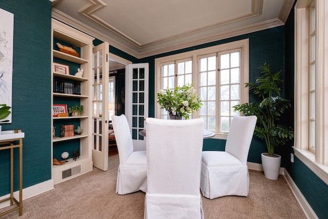 interior space with ornamental molding, french doors, and carpet flooring