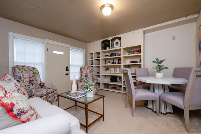 living room featuring light carpet