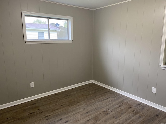 unfurnished room with dark wood-type flooring