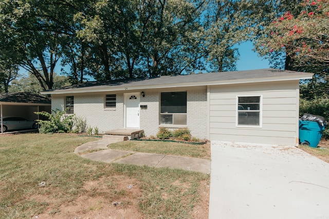 ranch-style home with a carport and a front yard