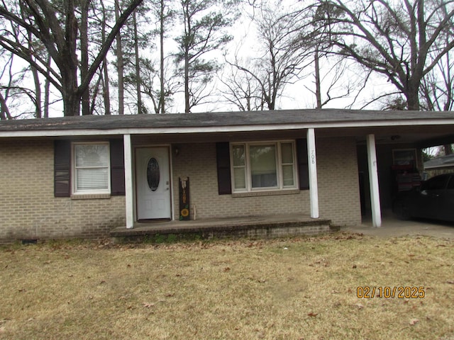 ranch-style house with a front lawn and a carport