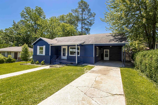 single story home with a carport, a porch, and a front lawn