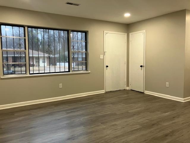 interior space with dark hardwood / wood-style flooring