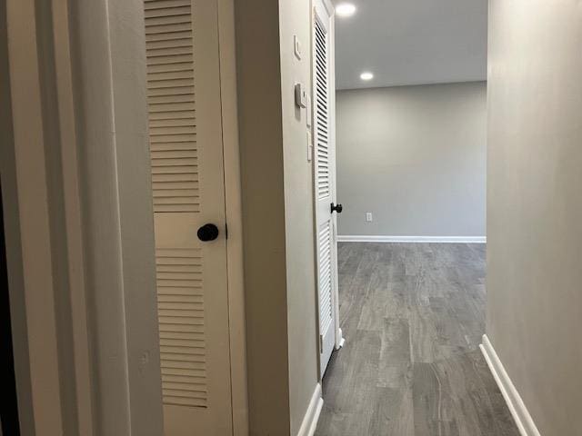 corridor featuring dark hardwood / wood-style flooring