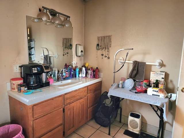 bathroom with tile patterned flooring and vanity