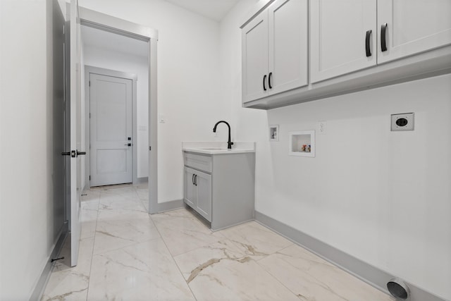 clothes washing area featuring washer hookup, sink, cabinets, and hookup for an electric dryer