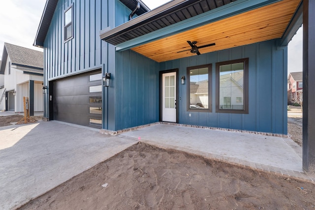 exterior space featuring ceiling fan and a garage