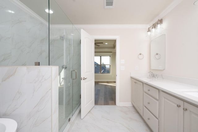 bathroom featuring crown molding, vanity, and walk in shower