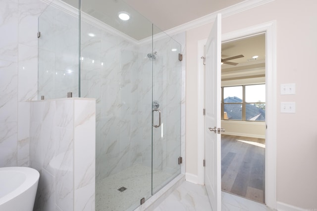 bathroom featuring crown molding and shower with separate bathtub