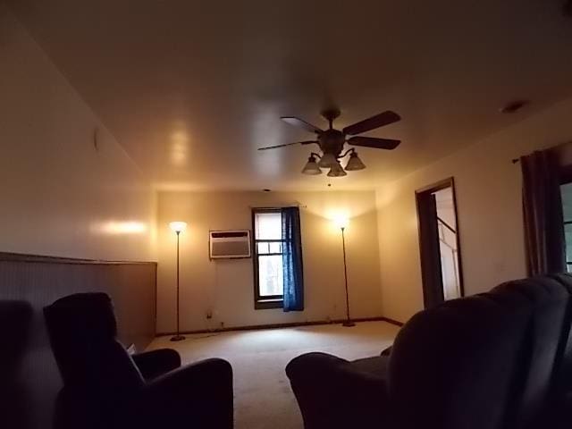 carpeted living room featuring ceiling fan and a wall mounted AC