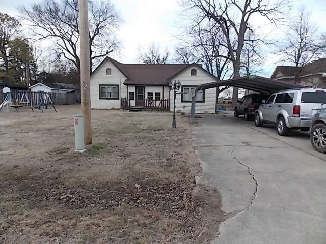 view of front of home featuring a carport