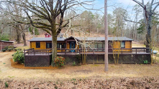 rear view of house with a wooden deck