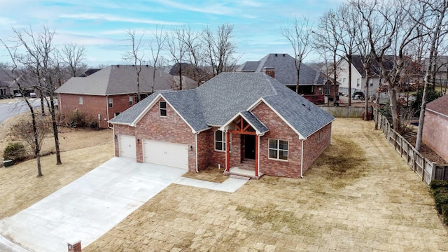 view of front of property featuring a garage and a front lawn