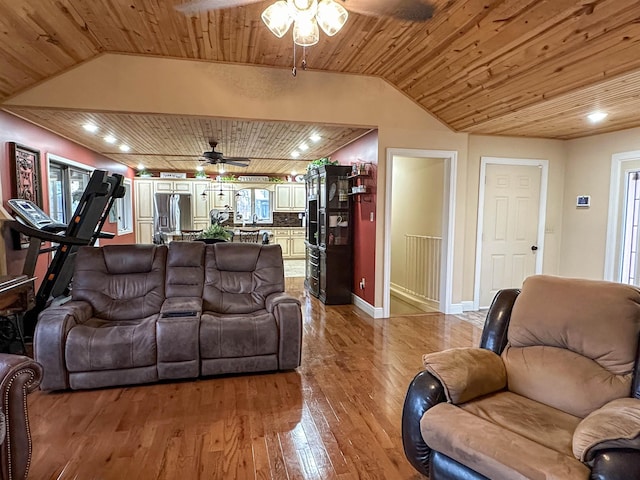 living room with wood ceiling, ceiling fan, wood-type flooring, and vaulted ceiling