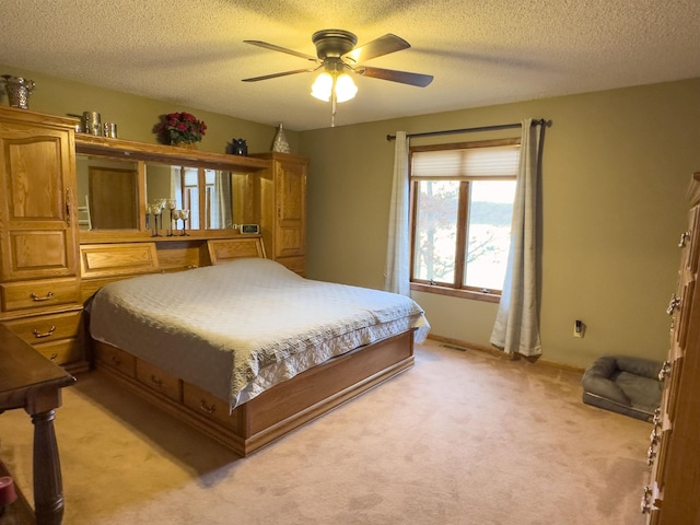 carpeted bedroom featuring a textured ceiling