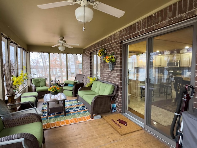 sunroom / solarium with ceiling fan