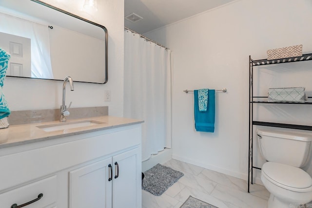 bathroom featuring vanity, curtained shower, and toilet