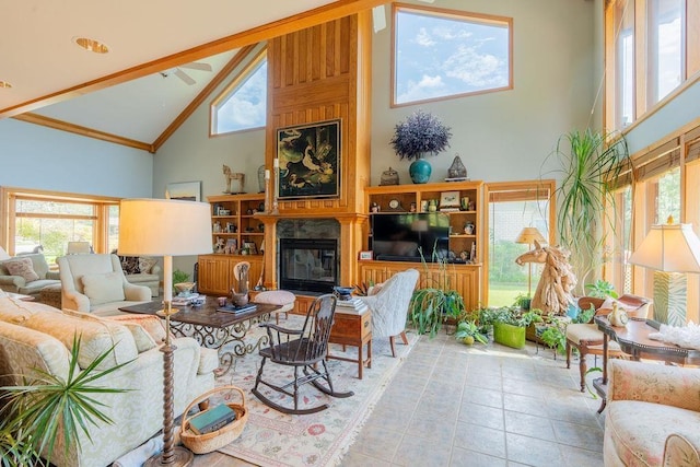 living room with a large fireplace and high vaulted ceiling