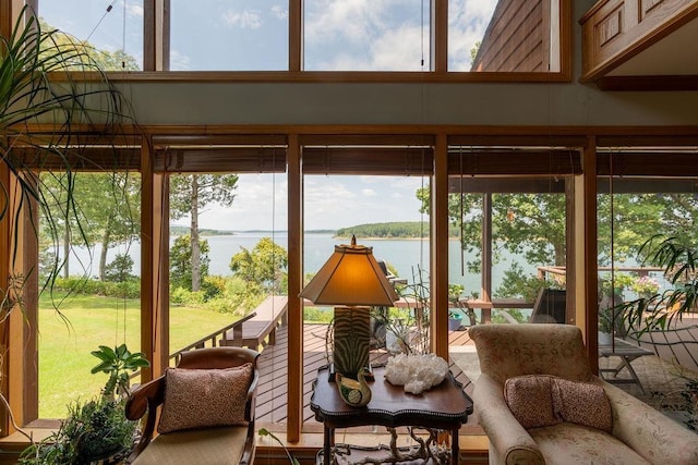 sunroom / solarium with a water view