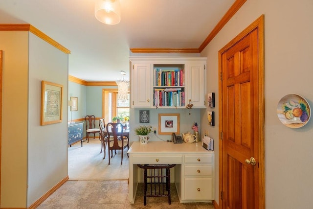 home office featuring crown molding and built in desk