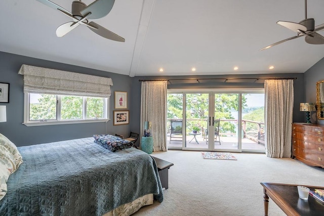 bedroom featuring french doors, access to exterior, vaulted ceiling, and carpet