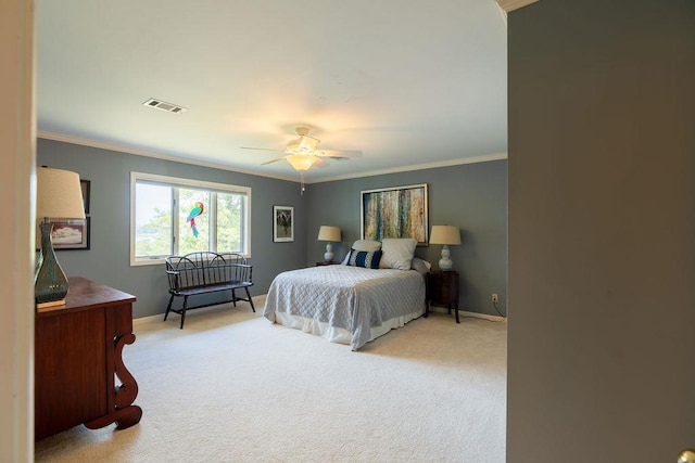 bedroom featuring crown molding, light carpet, and ceiling fan