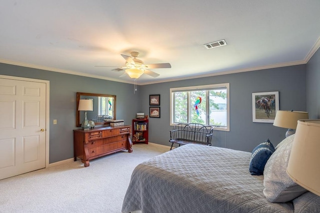 carpeted bedroom featuring ceiling fan and ornamental molding