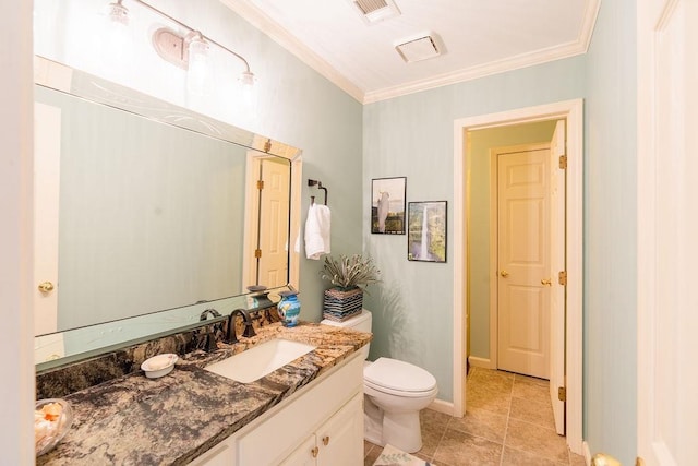 bathroom with crown molding, vanity, toilet, and tile patterned flooring