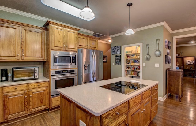 kitchen with stainless steel appliances, a kitchen island, dark wood-type flooring, and pendant lighting