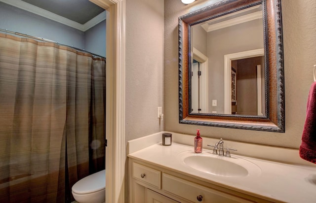 bathroom with ornamental molding, vanity, toilet, and curtained shower