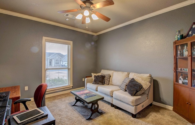 office area with ornamental molding, light colored carpet, and ceiling fan