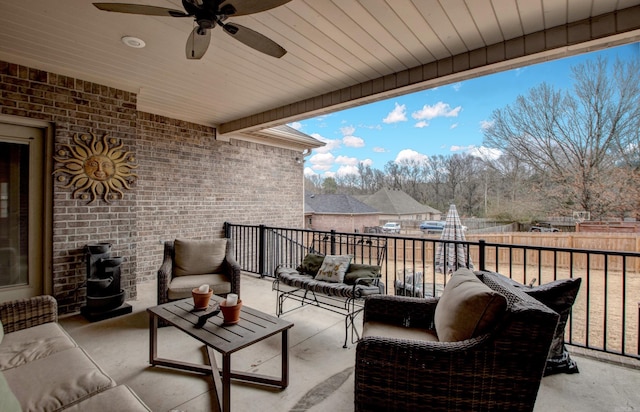 view of patio featuring an outdoor living space and ceiling fan