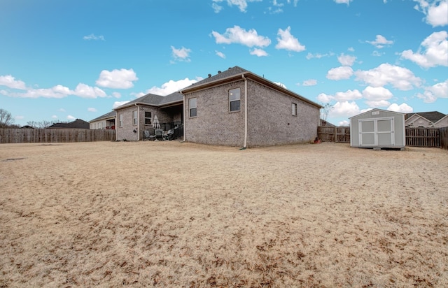 rear view of house with a shed