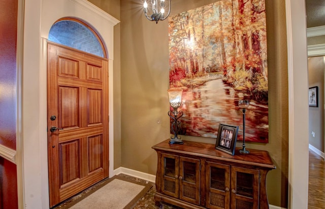 foyer entrance with a chandelier