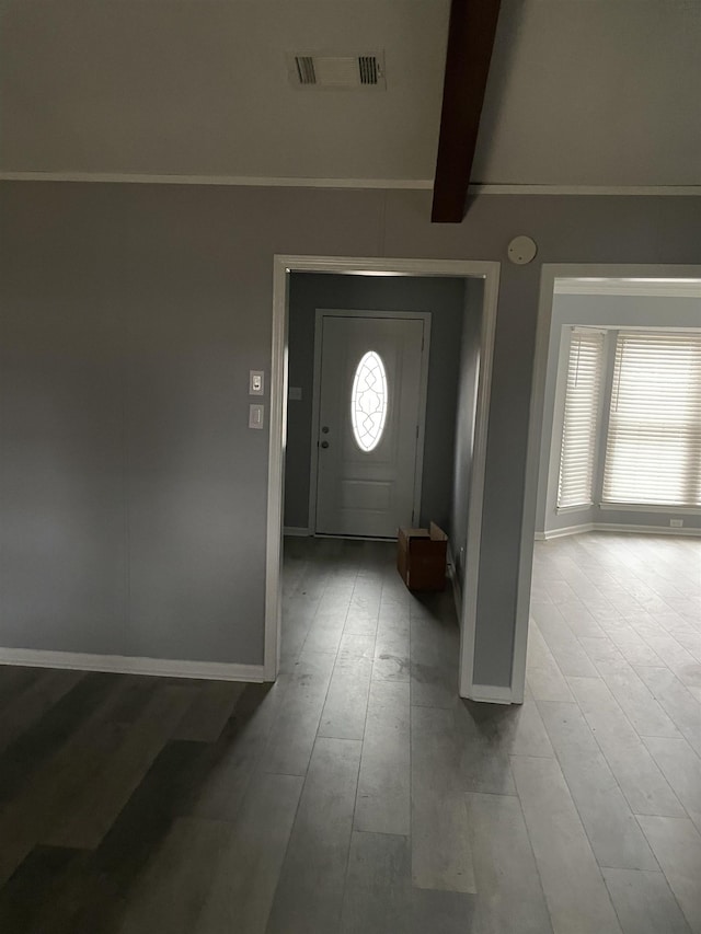 entrance foyer with beamed ceiling and light wood-type flooring