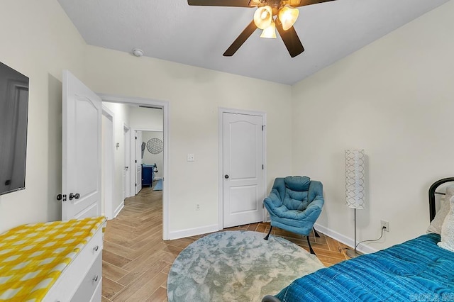 bedroom featuring ceiling fan and light parquet flooring