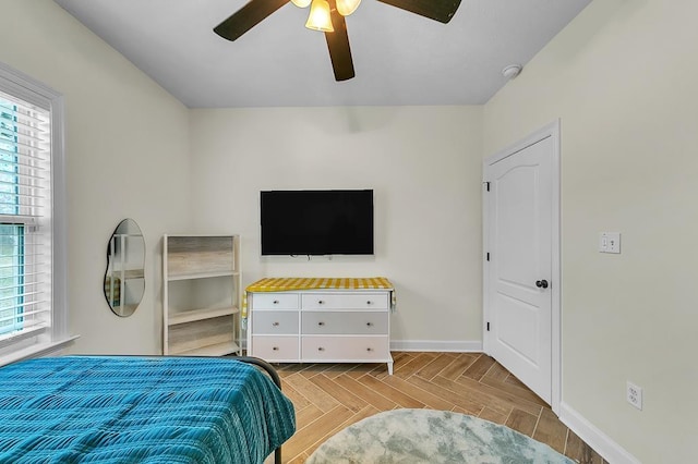 bedroom with light parquet floors and ceiling fan