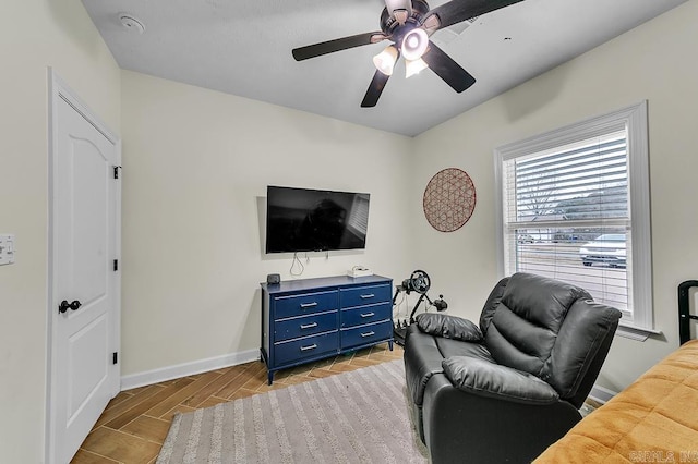 living room with ceiling fan and light wood-type flooring