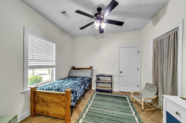 bedroom featuring ceiling fan and wood-type flooring