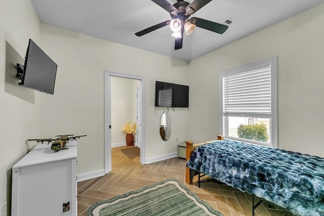 bedroom with parquet floors and ceiling fan