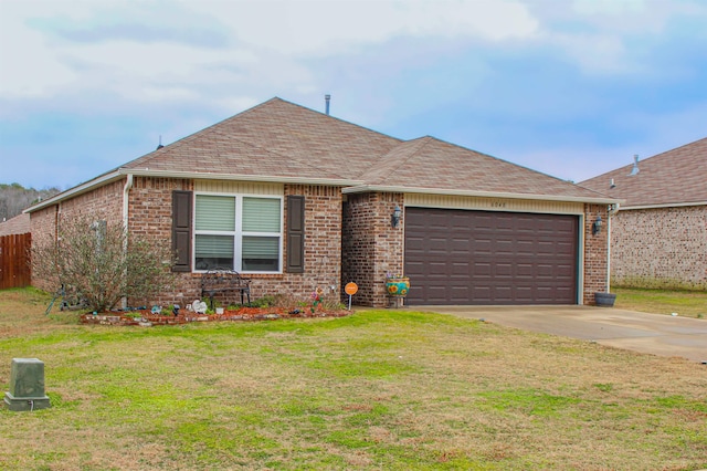 single story home with a garage and a front lawn