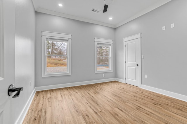 unfurnished room with ceiling fan, crown molding, light hardwood / wood-style flooring, and a healthy amount of sunlight