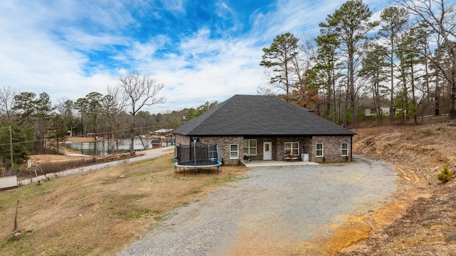 view of front of home featuring a trampoline