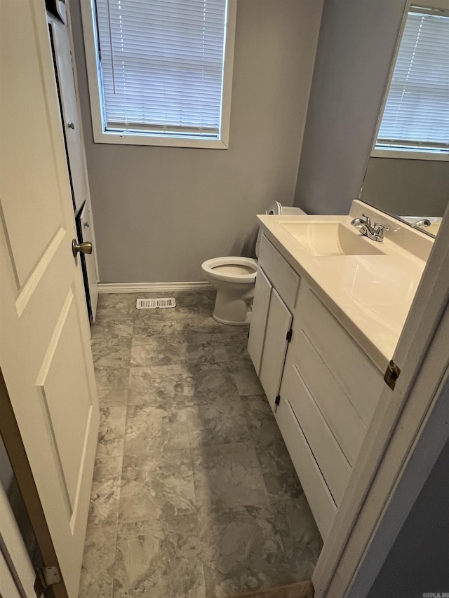 bathroom with vanity and toilet