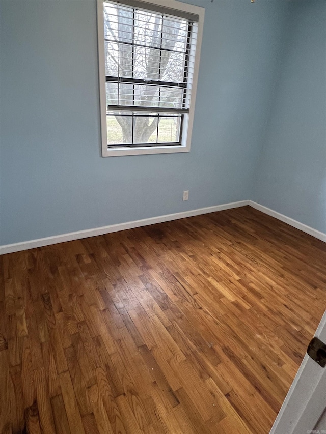 spare room featuring hardwood / wood-style flooring