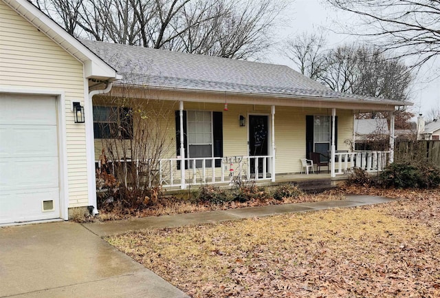 view of front of house featuring a garage and covered porch