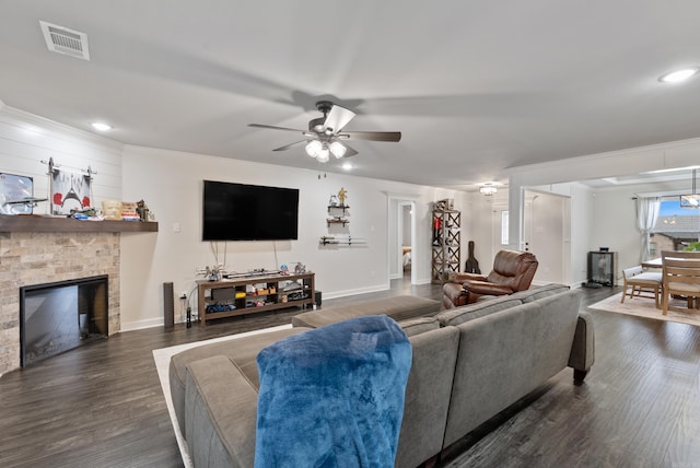 living room featuring dark wood-type flooring, ceiling fan, and ornamental molding