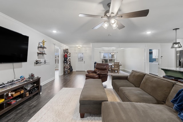 living room featuring ornamental molding, dark hardwood / wood-style floors, and ceiling fan