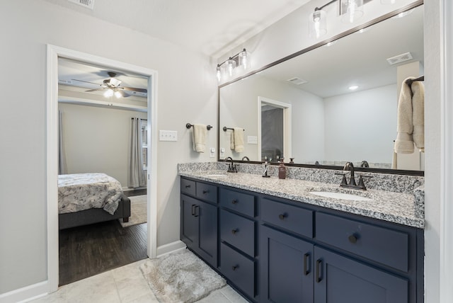 bathroom featuring vanity, tile patterned floors, and ceiling fan